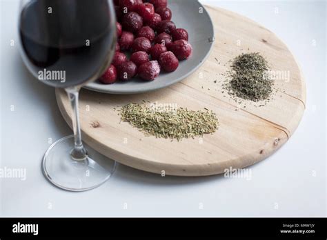 Cherries And Wine Rosemary And Thyme Composition Isolated On White