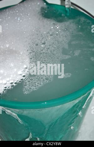 Bucket Overflowing With Hot Soapy Water Stock Photo Alamy