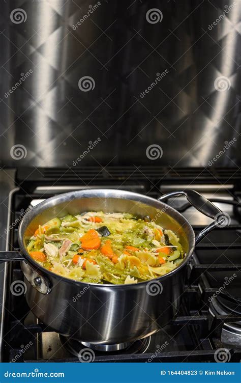 Cooking Soup In A Metal Pan On A Gas Stove Chicken Vegetable Soup With