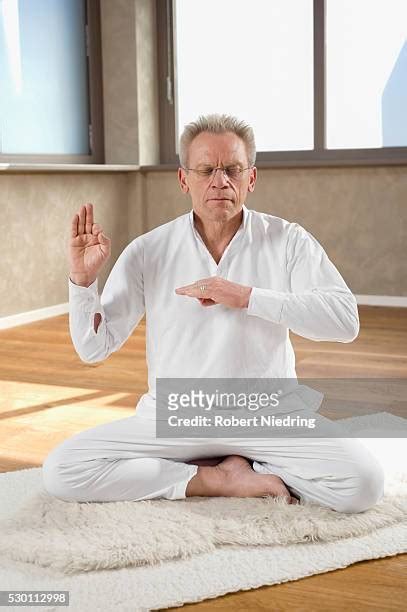 43 Man Sitting Cross Legged On Floor Eyes Closed Portrait Stock Photos