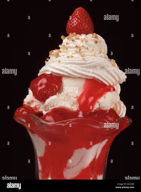 Close Up Strawberry Ice Cream Sundae Sunday Glass Dish Whipped Cream Sprinkle Nuts Sauce Vanilla