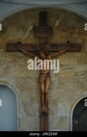 Shirtless Man Crucified On Wooden Cross Screaming Isolated On Black