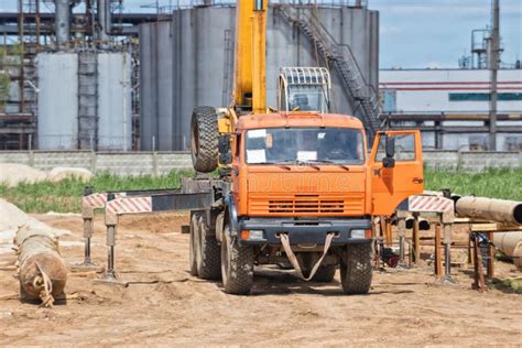 Construction Work on Pipe Laying of Pipeline into Trench Using a Stock ...