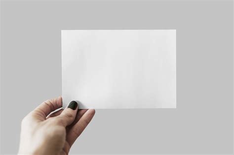 Free Postcard Mockup In Hand Psd