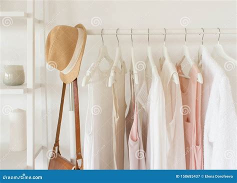 Fashion Clothes Concept Female Blouses T Shirts And Dresses On Hanger