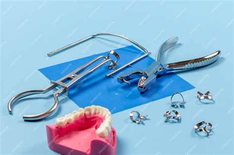 Premium Photo Dental Hole Punch The Clamps And The Rubber Dam Forceps