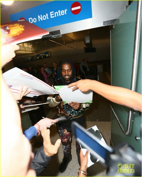 Kanye West Breaks Up Paparazzi Fight At Lax Airport Video Photo