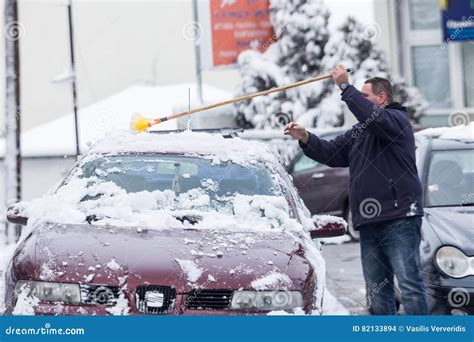 Man Cleaning His Car From The Snow Editorial Stock Image Image Of