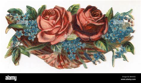 Red Roses And Forget Me Nots In A Basket Stock Photo Alamy