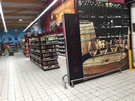 The Interior Of A Grocery Store Filled With Lots Of Bottles And Wine