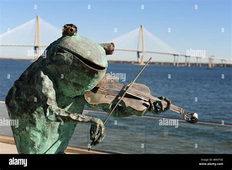 Art Frog With Fiddle In Front Of Arthur J Ravenel Bridge Charleston