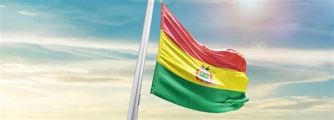 Premium Photo Bolivia National Flag Waving In Beautiful Sky