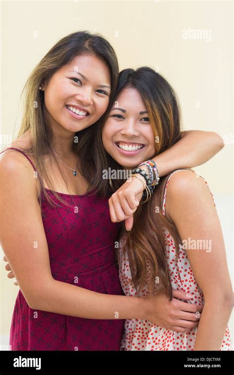 Two Smiling Women Posing For The Camera Stock Photo Alamy