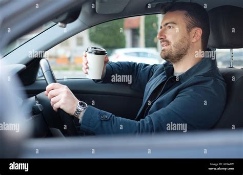 Man Drinking Coffee Driving Car Hi Res Stock Photography And Images Alamy