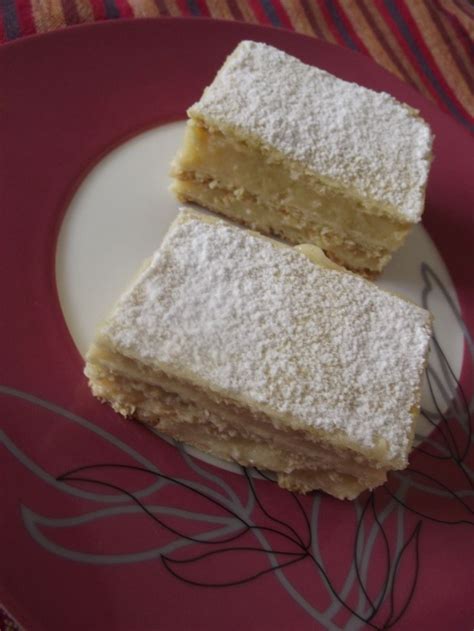 Two Pieces Of Cake Sitting On Top Of A Plate