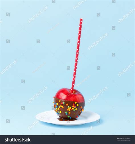 Minimal Concept With Copy Space Red Candy Apple With Chocolate On A