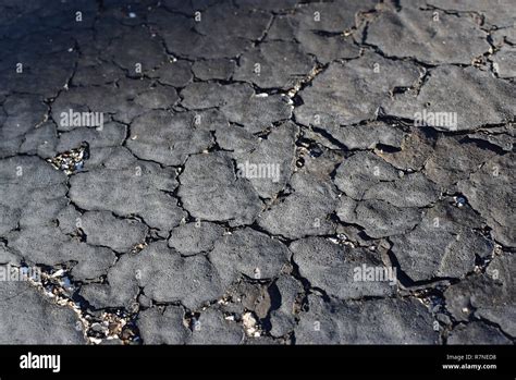 Old Black Drivfeway With Cracked Pavement Hi Res Stock Photography And