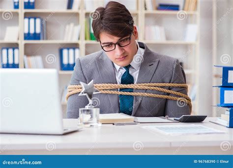 The Businessman Tied Up With Rope In Office Stock Photo Image Of