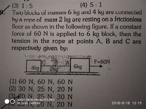 Two Blocks Of Masses Kg And Kg Are Connected By A Rope Of Mass Kg