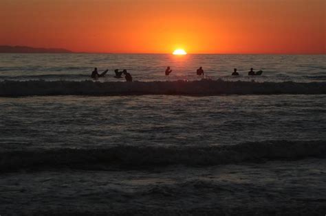 Surfing at sunset Photograph by Julie Gregorchuk - Fine Art America