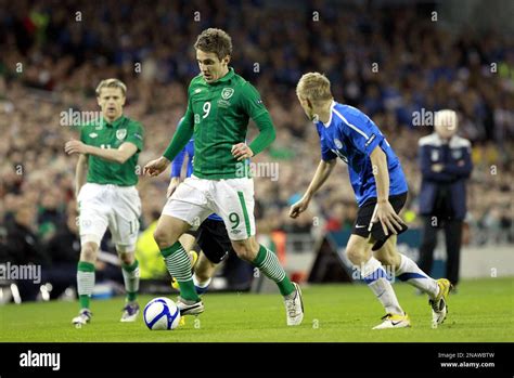 Republic Of Irelands Kevin Doyle Left Wins The Ball Fron Estonias