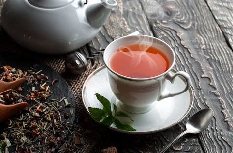 Premium Photo Hot Tea In A Cup On An Old Table