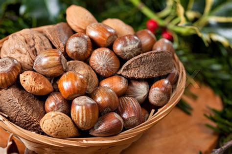 Various Christmas nuts in basket with ... | Stock image | Colourbox