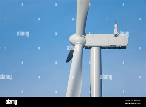 Wind Turbine Against Blue Sky Stock Photo Alamy