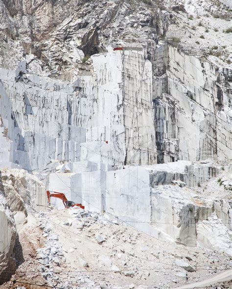 Carrara White Marble Quarry And An Excavator Tuscany Italy Stock