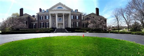 The outside of Richie Rich mansion with round about drive.