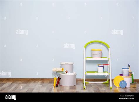 Set for wall painting in empty room Stock Photo - Alamy