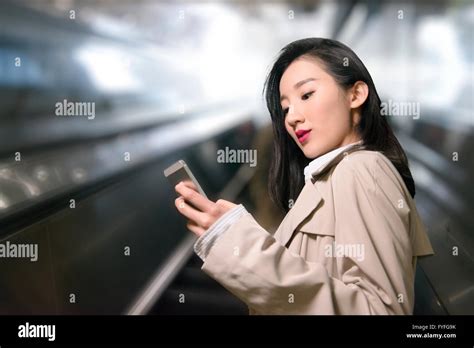 businesswoman  escalator stock photo alamy
