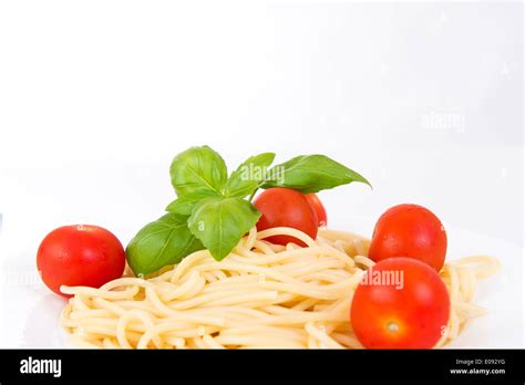 Spaghetti With Cherry Tomatoes And Basil On White Background Stock