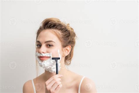 Woman shaving face with razor 22429423 Stock Photo at Vecteezy