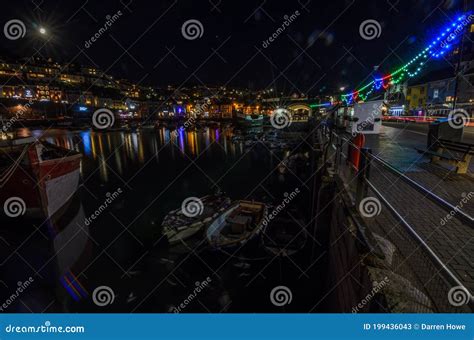 Brixham Harbour at night stock image. Image of water - 199436043