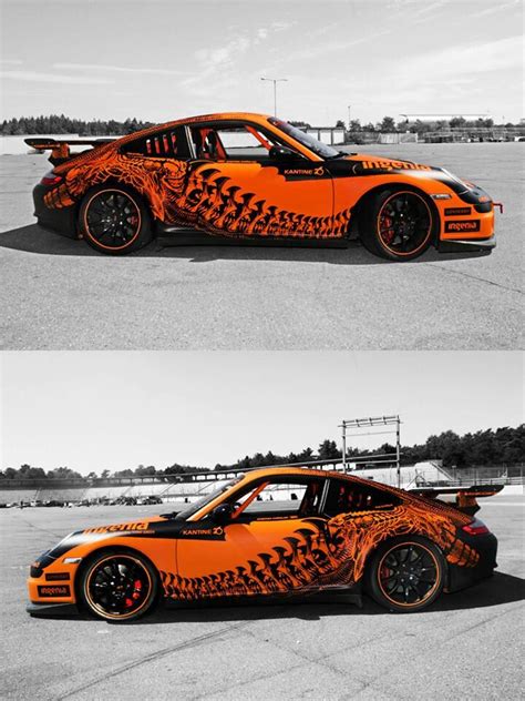 An Orange Car With Flames Painted On It S Side And The Front End Is Shown