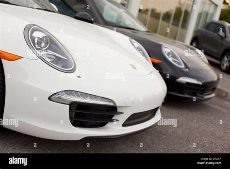 A Close Up Of 2 New 2012 Porsche 911 Carrera S Front Ends At The
