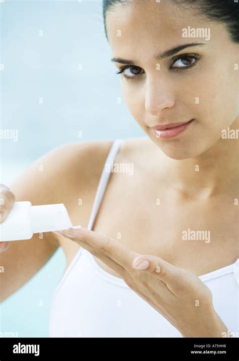 Woman Applying Sunscreen Stock Photo Alamy