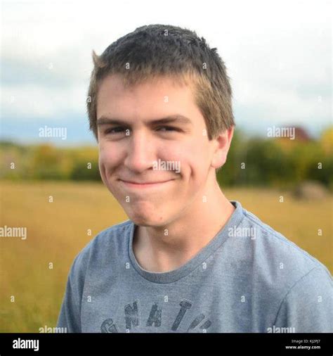 Young man with dimples Stock Photo - Alamy