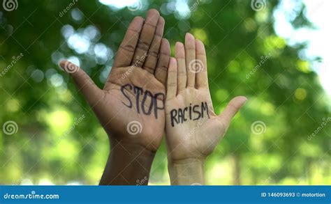 Interracial People Hands With Stop Racism Phrase Fight Against