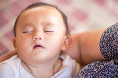 Premium Photo Portrait Of Cute Baby Sleeping On Bed