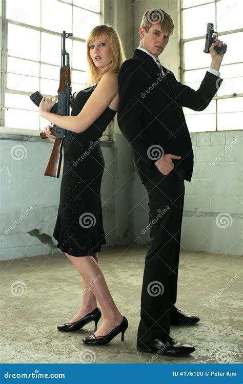 Young Couple With Guns Stock Photo Image Of Formal Couple 4176100