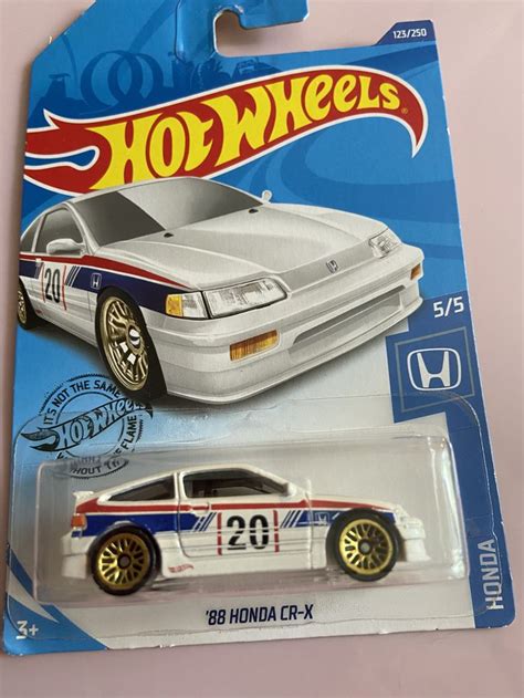 A Hot Wheels White Car With Red White And Blue Stripes