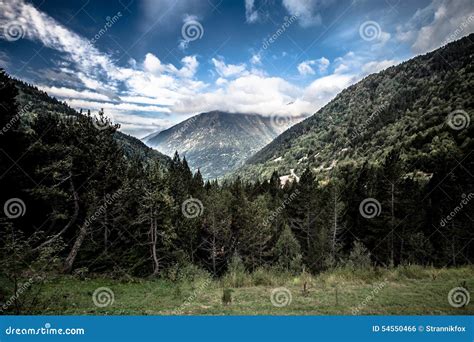 Forest Mountains And Clouds Landscape Andorra Toned Stock Photo