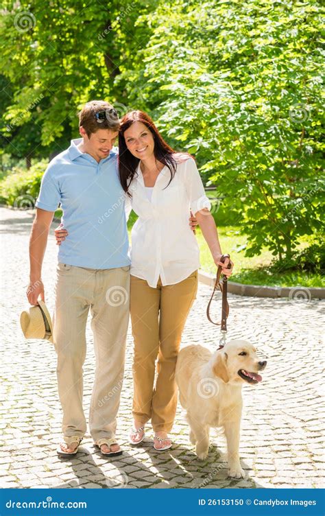 Young Couple In Love Walking Dog Park Stock Photo - Image: 26153150