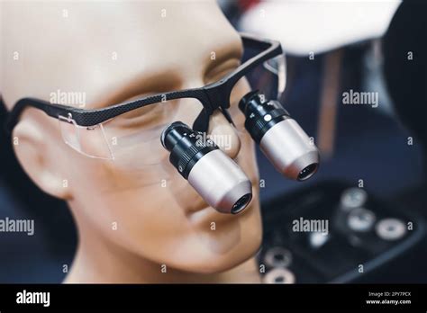 Dental Microscope Protection Glasses On Display On A Medical Model