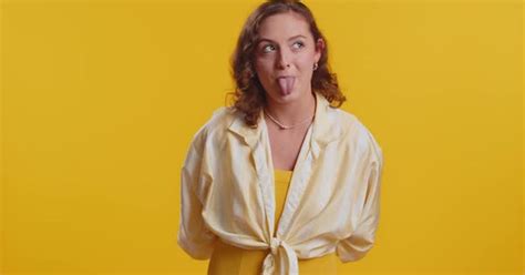 Cheerful Funny Bully Young Woman Showing Tongue Making Silly Faces