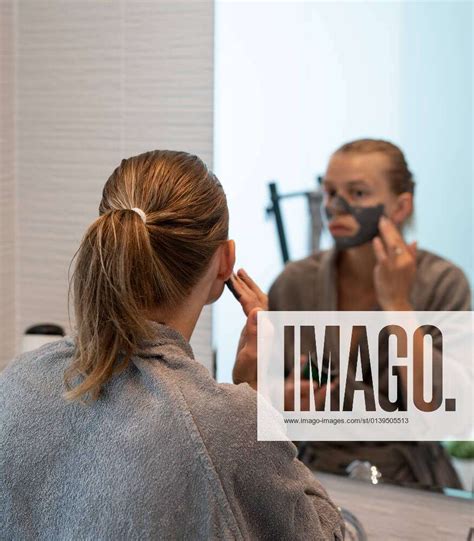 Woman Applying Face Mask In The Bathroom Womens Health Spa And