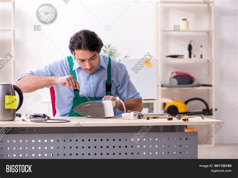 Young Man Repairing Image And Photo Free Trial Bigstock