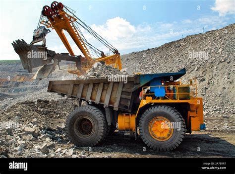 Large Quarry Dump Truck Loading The Rock In The Dumper Loading Coal